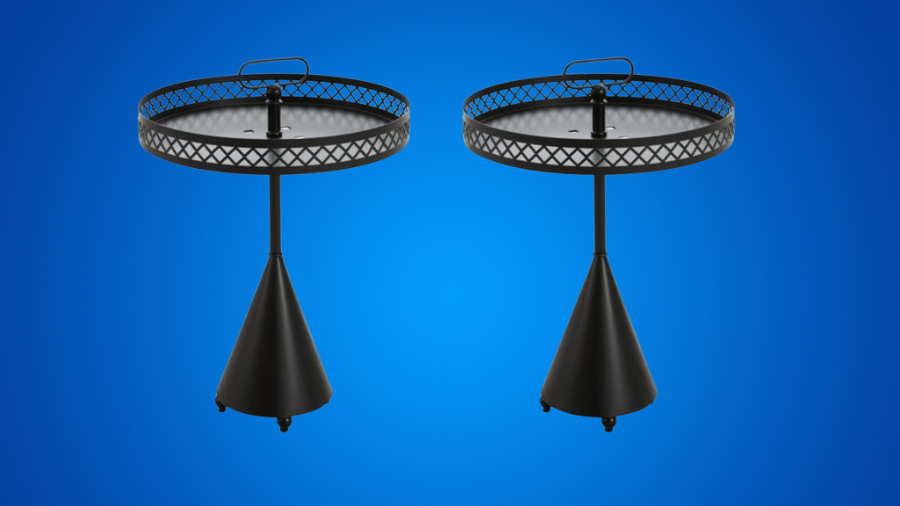 Two black metal side tables with lattice tray tops, conical bases, and a handle, set against a blue background.